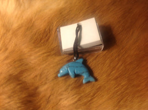 Carved stone dolphin necklace.  Made of turquoise.