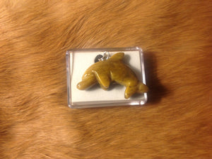 Carved jasper dolphin necklace.