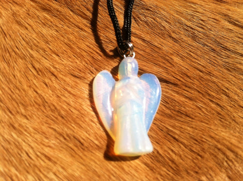 Carved stone angel necklace.  Made of opalite.