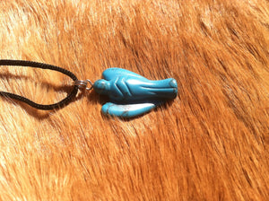 Carved stone angel necklace.  Made of turquoise.