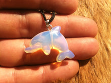 Load image into Gallery viewer, Carved stone dolphin necklace.  Made of Opalite.