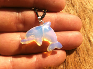 Carved stone dolphin necklace.  Made of Opalite.