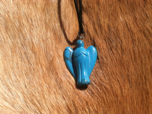 Carved stone angel necklace.  Made of turquoise.