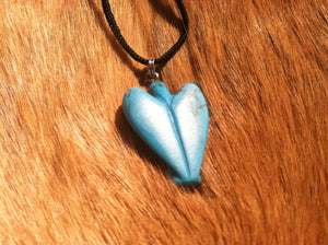 Carved stone angel necklace.  Made of turquoise.