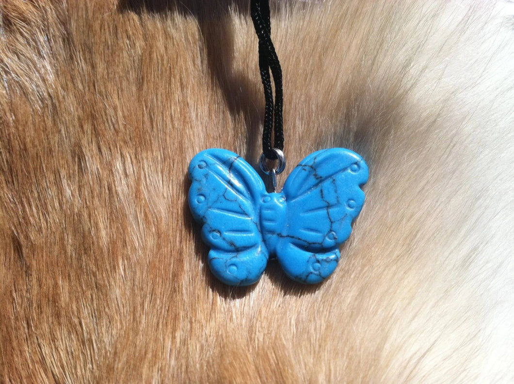 Carved stone butterfly necklace.  Made of turquoise.