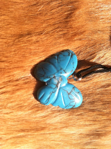 Carved stone butterfly necklace.  Made of turquoise.