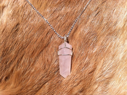 Rose quartz crystal wire wrap with sterling silver chain.