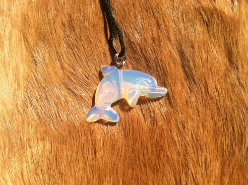 Carved stone dolphin necklace.  Made of Opalite.