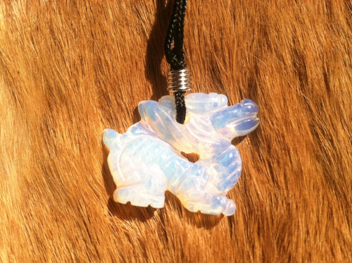 Carved stone dragon necklace.  Made of Opalite.