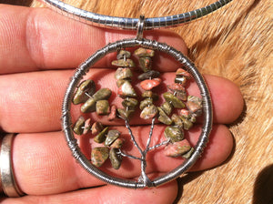 Tree of life wire wrapped pendent made with real tumbled unakite. With wide sterling silver chain.