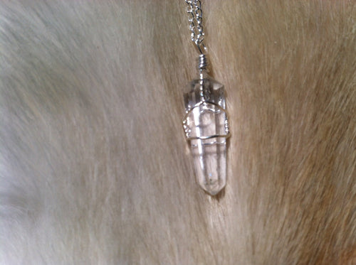 Quartz crystal wire wrap with sterling silver chain.