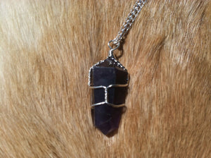 Amethyst crystal wire wrap with sterling silver chain.