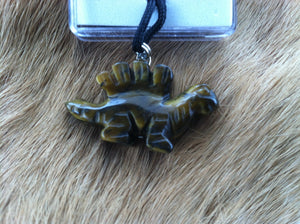 Carved stone dinosaur necklace.  Made of Tiger Eye