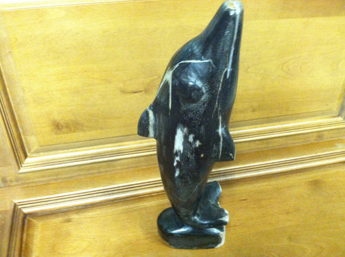 petrified wood dolphin statue